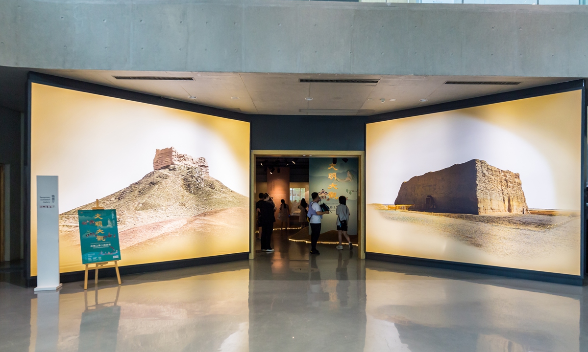 Visitors explore the Convergence of Civilizations, Dunhuang on the Silk Road Exhibition at the China National Silk Museum in Hangzhou, East China's Zhejiang Province. Photo: VCG