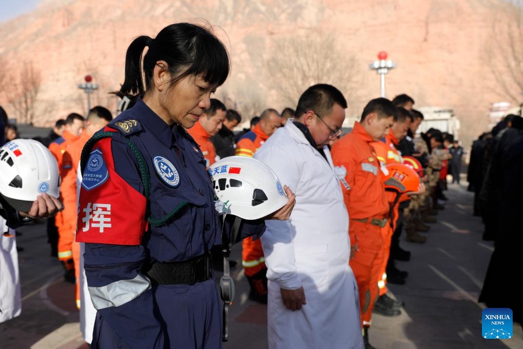 People pay a silent tribute during a commemorative event for earthquake victims at a square in Dahejia Township of Jishishan County, northwest China's Gansu Province, Dec. 25, 2023. A 6.2-magnitude earthquake jolted Jishishan County of Gansu Province on Dec. 18.(Photo: Xinhua)