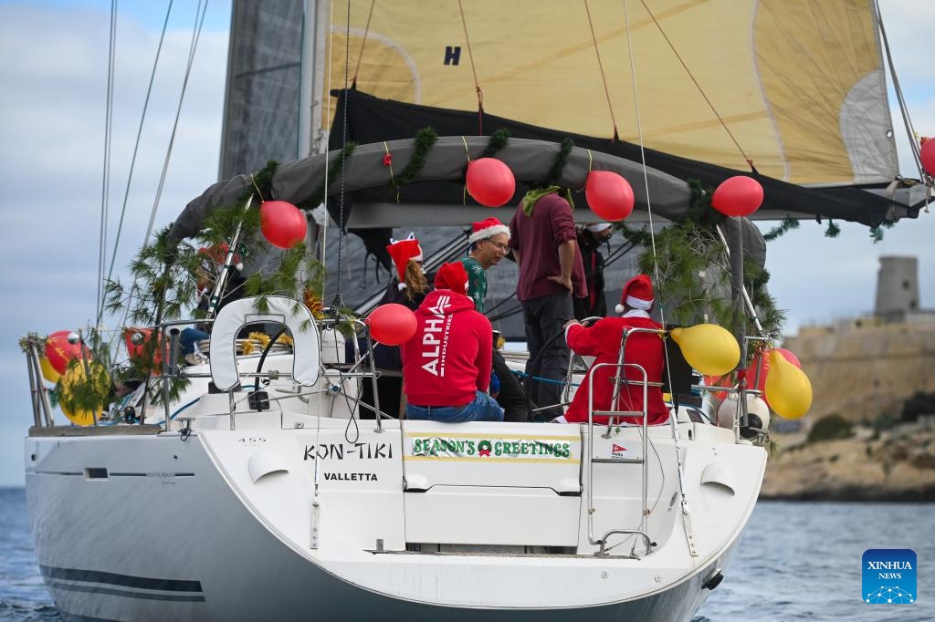 People take part in the traditional Boxing Day Fun Race for charity in Ta' Xbiex, Malta, Dec. 26, 2023.(Photo: Xinhua)