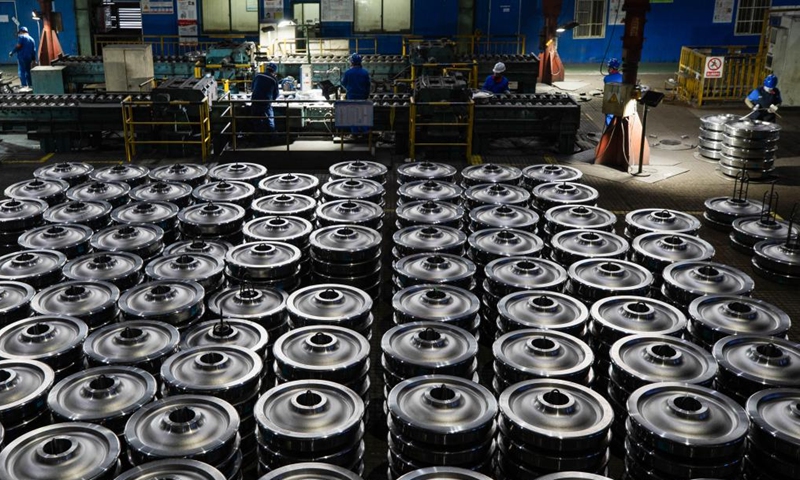 Employees package wheel products at a workshop in China Baowu Group Masteel Rail Transit Materials Technology Co., Ltd. (MRT) in Ma'anshan, east China's Anhui Province, Dec. 15, 2023. (Photo: Xinhua)