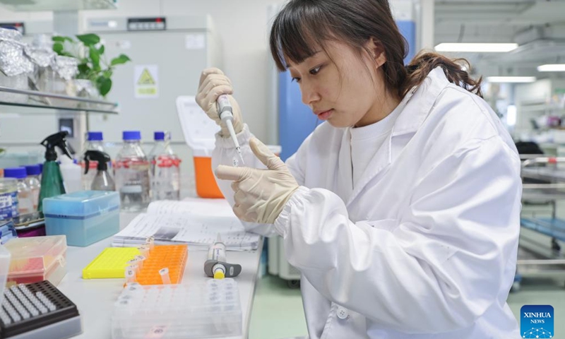 A researcher conducts experiments at a seed laboratory in Sanya, south China's Hainan Province, Dec. 29, 2023. Sanya's abundance of sunlight expedites the breeding cycle, drawing numerous researchers from across the country to breed new species of crops every October till the next April. (Photo: Xinhua)