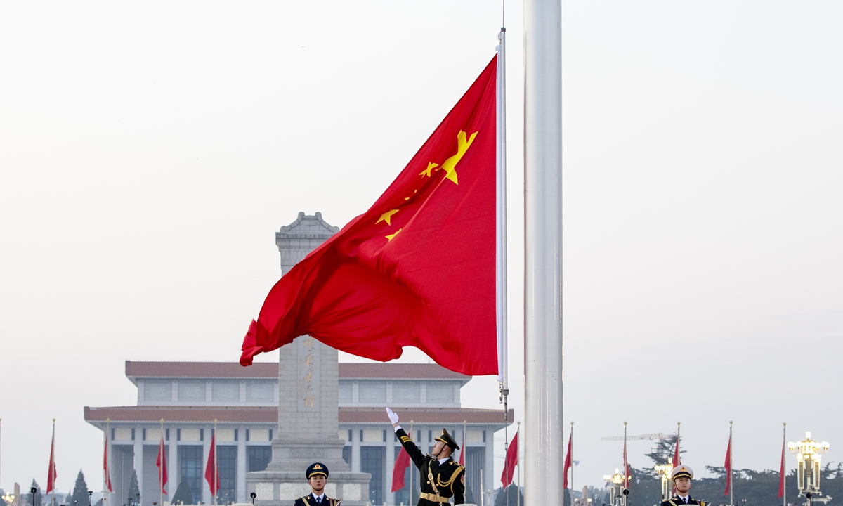 China holds its first flag-raising ceremony of the new year on the Tiananmen Square in downtown Beijing on the early morning of January 1, 2024. More than 73,000 people, many of whom come from other parts of the country, gathered on the square to salute the rising of the Five-star Red Flag to mark the first day of 2024. Photo: VCG