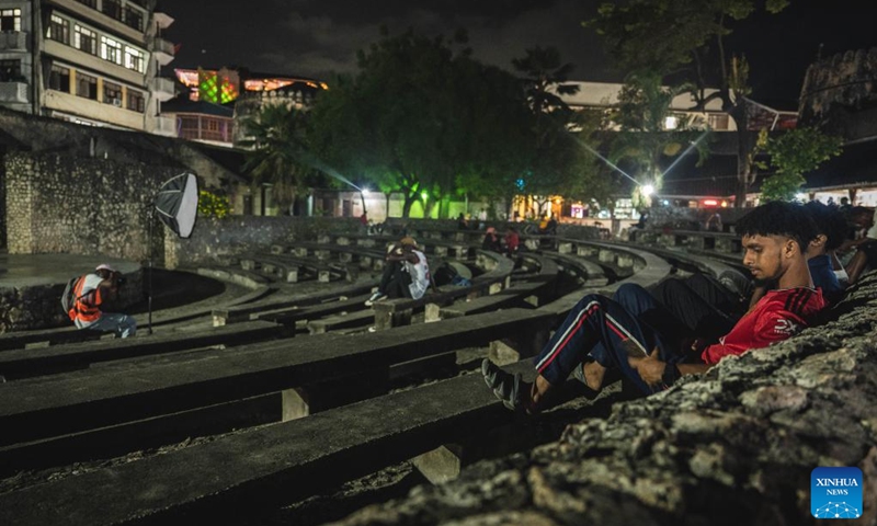 People enjoy leisure time in the Stone Town of Zanzibar, Tanzania, Dec. 31, 2023. Zanzibar consists of two large coral islands - Zanzibar and Pemba, and more than 20 adjacent islets. For nearly 10 centuries, Zanzibar has blended the diverse cultures of Africa, Asia and Europe, becoming an important cultural attraction and holiday destination in East Africa. (Photo: Xinhua)