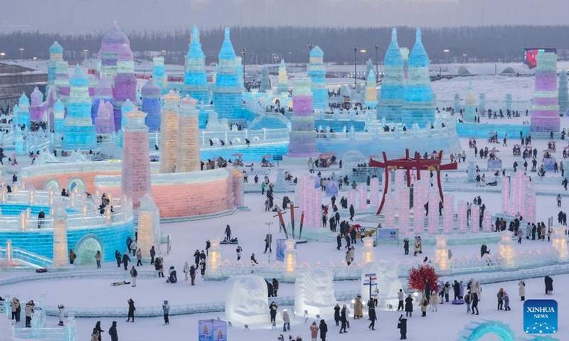 People visit the Sun Island scenic area in Harbin, northeast China's Heilongjiang Province, Jan. 1, 2024. Heilongjiang Province has abundant ice-and-snow resources, making it a popular destination for winter tourism in China and attracting numerous tourists from home and abroad during the New Year holiday.(Photo:Xinhua)