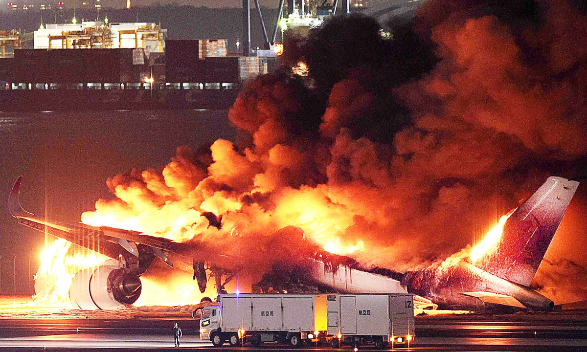 This photo provided by Jiji Press shows a Japan Airlines plane on fire on a runway of Tokyo's Haneda Airport on January 2, 2024, after colliding with a Japan Coast Guard aircraft.The Coast Guard said the collision involved one of its planes that were headed to Niigata airport on Japan's west coast to deliver aid to those caught up in a powerful earthquake. Photo: AFP