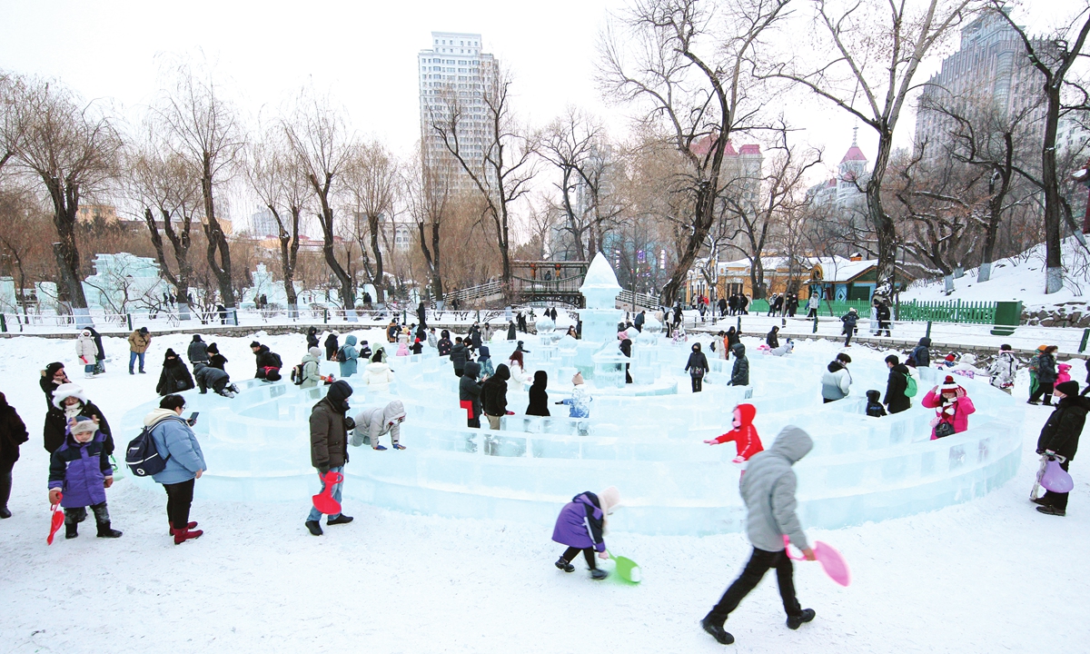 Locals and tourists play around ice sculptures in Zhaolin Park, Harbin, capital city of Northeast China's Heilongjiang Province, on January 1, 2024. Winter tourism boomed in Harbin, which received over 3 million tourists during the three-day New Year holiday. Photo: IC
