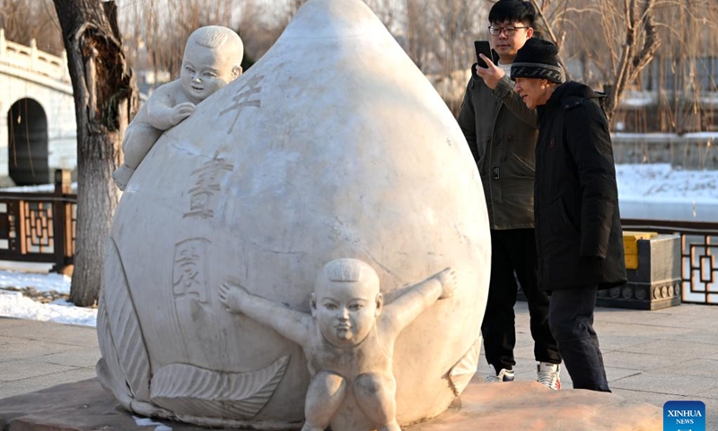Xi Wang (L) and his mentor Wang Wenda visit a new year picture-themed park in Tianjin, north China, Dec. 27, 2023.  (Photo: Xinhua)