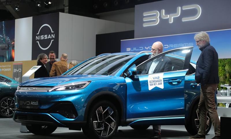 Visitors experience a BYD Atto 3 during the press day of the 100th Brussels Motor Show in Brussels, Belgium, Jan. 13, 2023.(Photo:Xinhua)