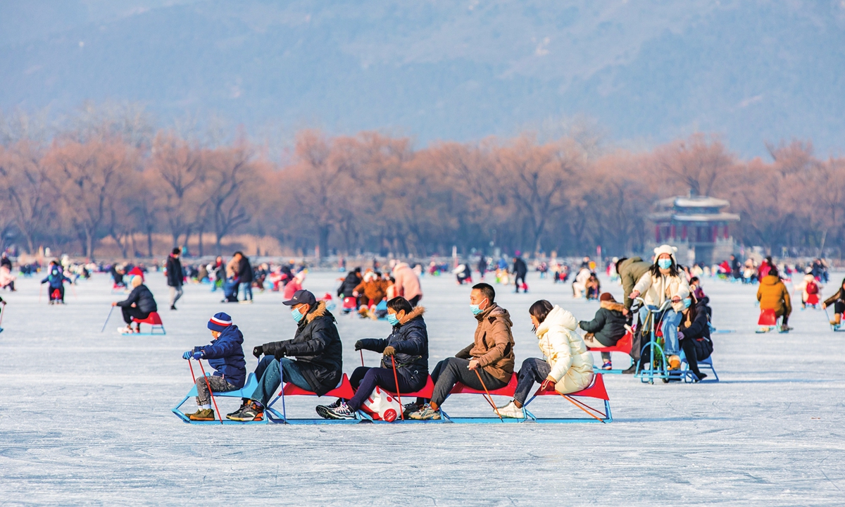 Visitors are ice carting on the ice rink inside Summer Palace in Beijing. Photo: VCG
