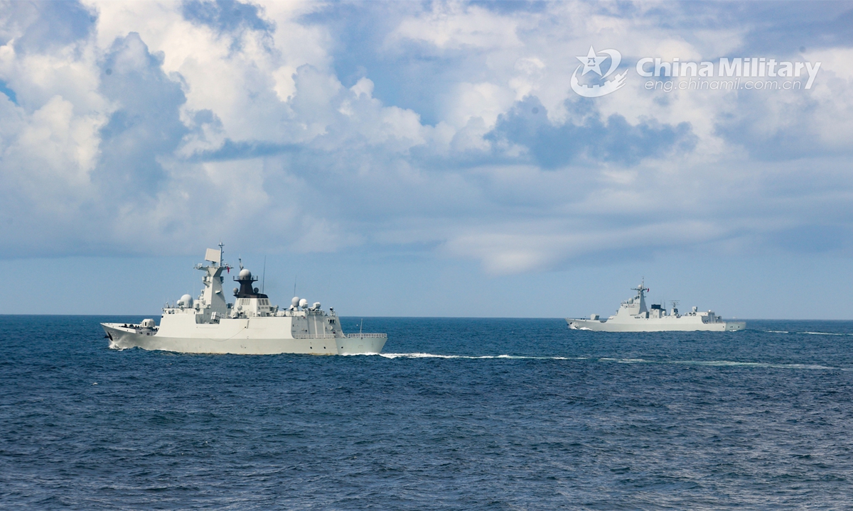 Warships attached to a destroyer flotilla with the PLA Navy sail in formation during a recent real-combat training exercise. (Photo:China Military)

