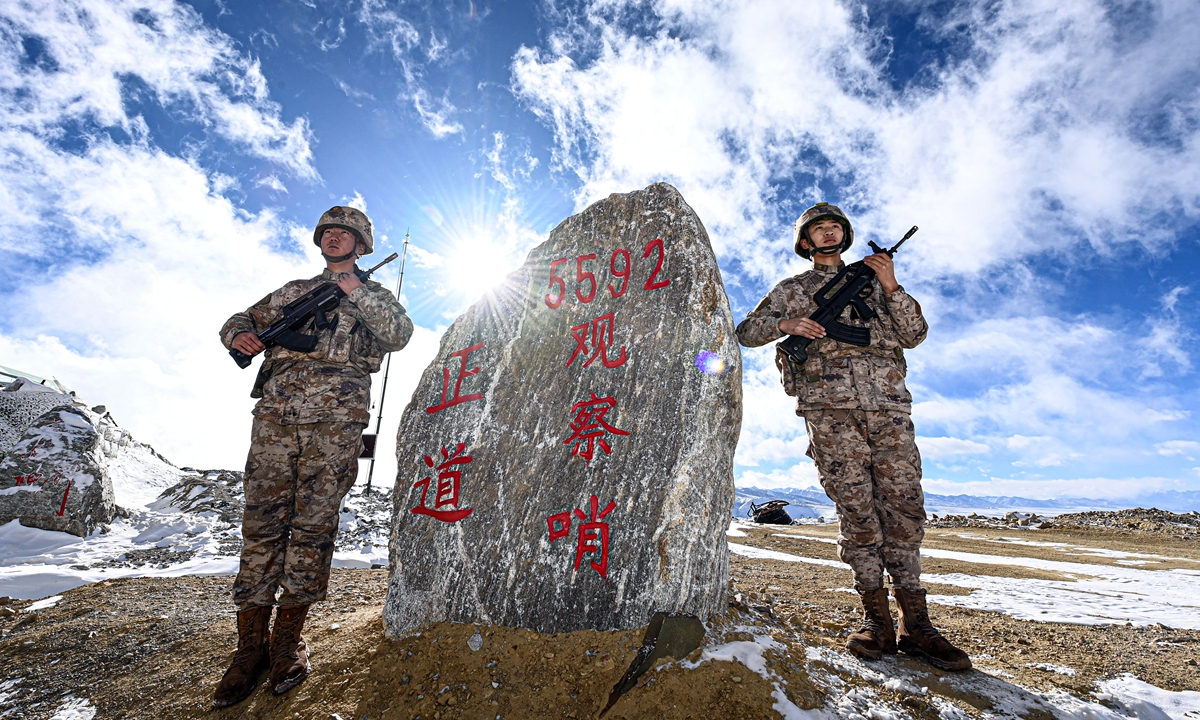 Soldiers stand guard at the “5592” watchpoint. Photo: Courtesy of the Xigaze Military Sub-district of the Xizang Military Region