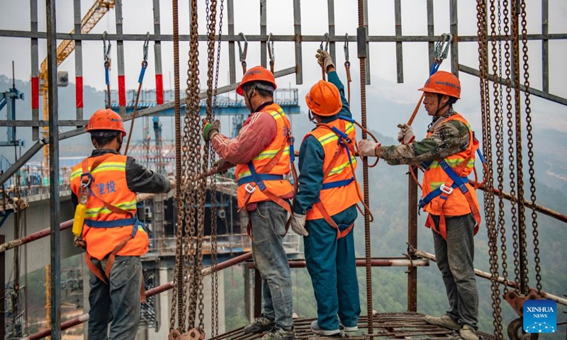 Workers are busy at the construction site of an expressway bridge in southwest China's Yunnan Province, Jan. 2, 2024. Workers around China have returned to their respective posts after the New Year holiday. (Photo: Xinhua)