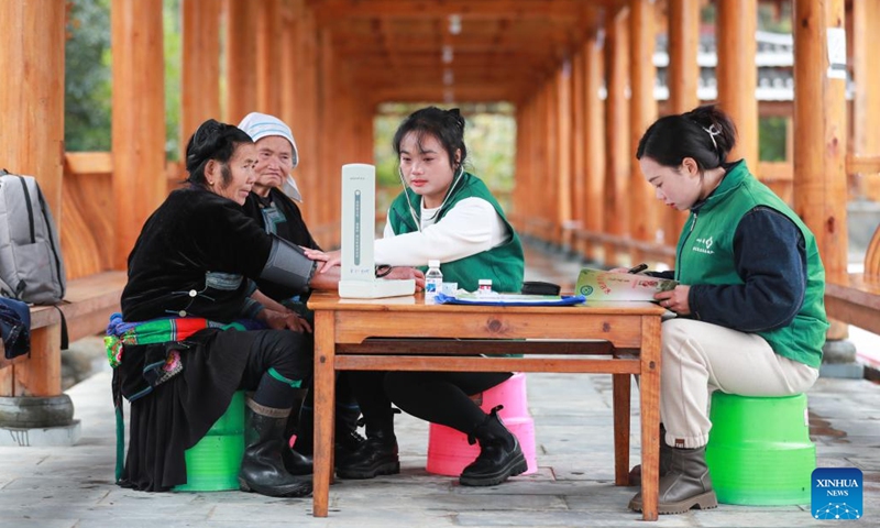A family doctor measures a villager's blood pressure in Gangbian Village of Congjiang County, southwest China's Guizhou Province, Jan. 2, 2024. Workers around China have returned to their respective posts after the New Year holiday. (Photo: Xinhua)