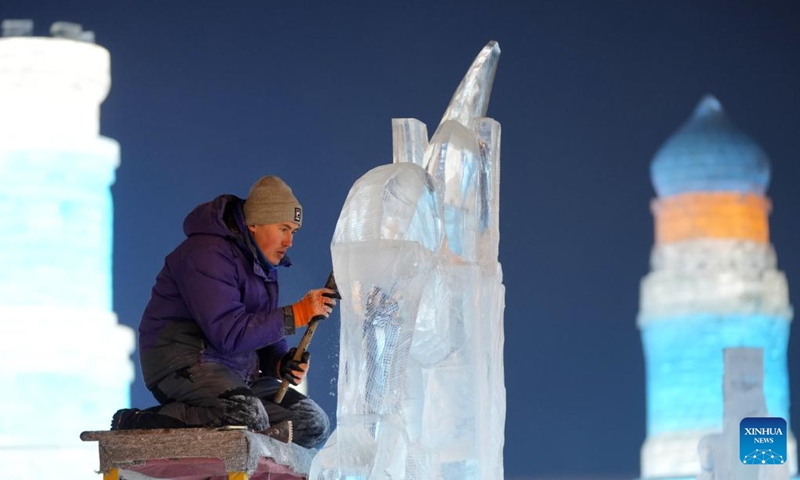 A competitor works on an ice sculpture during the 35th Harbin International Ice Sculpture Competition at Harbin Ice-Snow World in Harbin, northeast China's Heilongjiang Province, Jan. 2, 2024. The three-day competition kicked off here on Tuesday. (Photo: Xinhua)
