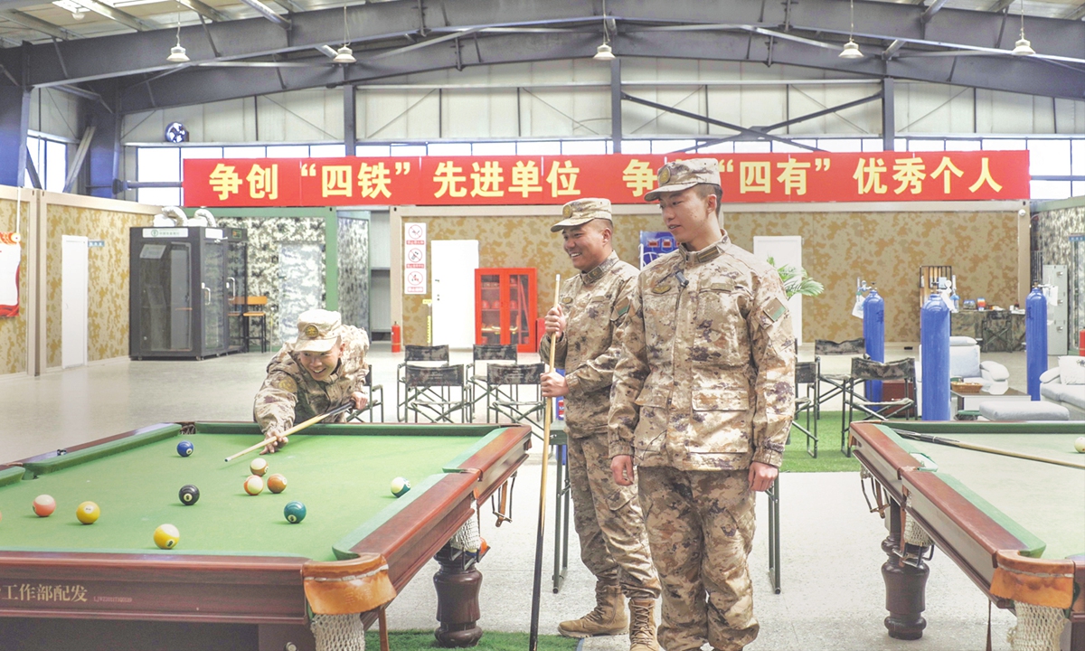 Officers and soldiers enjoy billiard at spare time at 