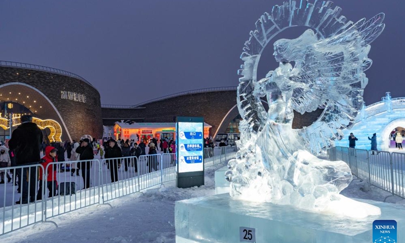 Visitors look at ice sculptures at Harbin Ice-Snow World in Harbin, northeast China's Heilongjiang Province, Jan. 4, 2024. The 35th Harbin International Ice Sculpture Competition concluded here on Thursday.(Photo: Xinhua)