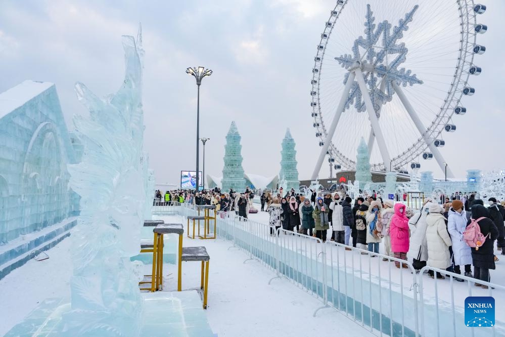 Visitors look at ice sculptures at Harbin Ice-Snow World in Harbin, northeast China's Heilongjiang Province, Jan. 4, 2024. The 35th Harbin International Ice Sculpture Competition concluded here on Thursday.(Photo: Xinhua)