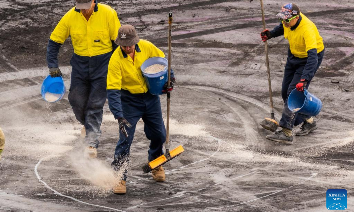 Staff members clean the ground during the Summernats car festival in Canberra, Australia, Jan 5, 2024. The car festival is held from Jan 4 to 7. Photo:Xinhua