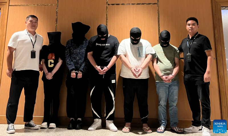 Myanmar police hand over five telecom and internet fraud suspects to Chinese police at Yangon International Airport in Yangon, Myanmar, August 26, 2023. Photo: Xinhua