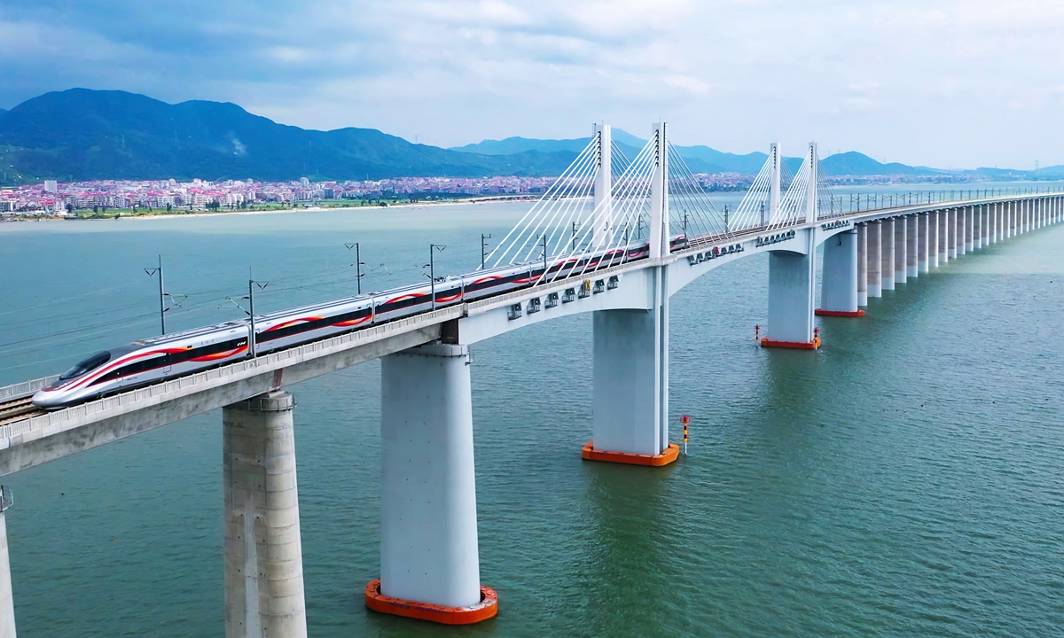 A Fuxing high-speed bullet train runs on the Fuzhou-Xiamen high-speed railway, China's first cross-sea high-speed railway on September 28, 2023. Photo: VCG