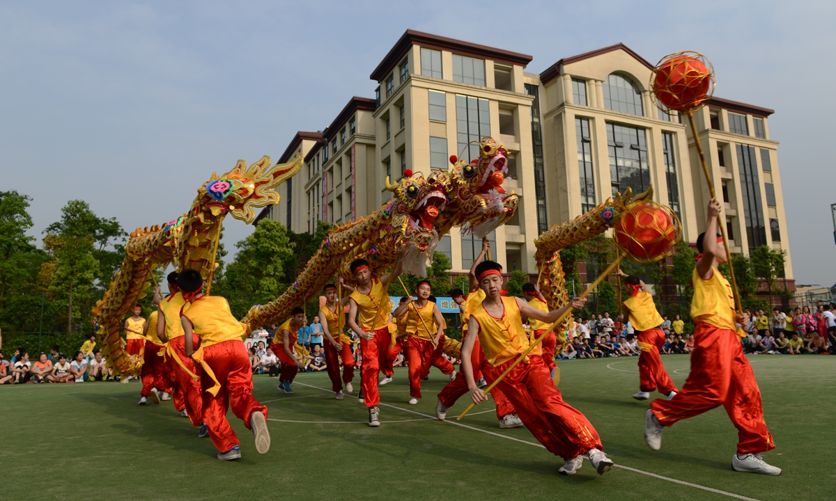 Students perform Tongliang dragon dance in a school in Tongliang district, Southwest China's Chongqing Municipality. Photo: Courtesy of Publicity Department of CPC Tongliang District Committee