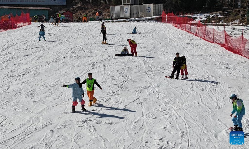 This aerial photo taken on Jan. 6, 2024 shows tourists skiing at a ski resort in Shuihou Township of Qianshan City, east China's Anhui Province. The tourist service of Shuihou Township at the foot of Tianzhu Mountain used to be limited to pure sightseeing in the mountainous areas. (Xinhua/Du Yu)