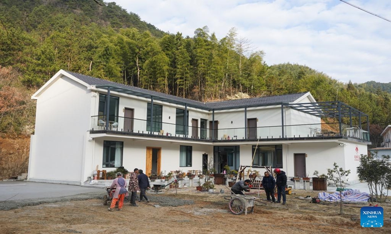 Villagers renovate a homestay in Tianzhu Village of Shuihou Township, Qianshan City, east China's Anhui Province, Jan. 6, 2024. The tourist service of Shuihou Township at the foot of Tianzhu Mountain used to be limited to pure sightseeing in the mountainous areas.. (Xinhua/Du Yu)