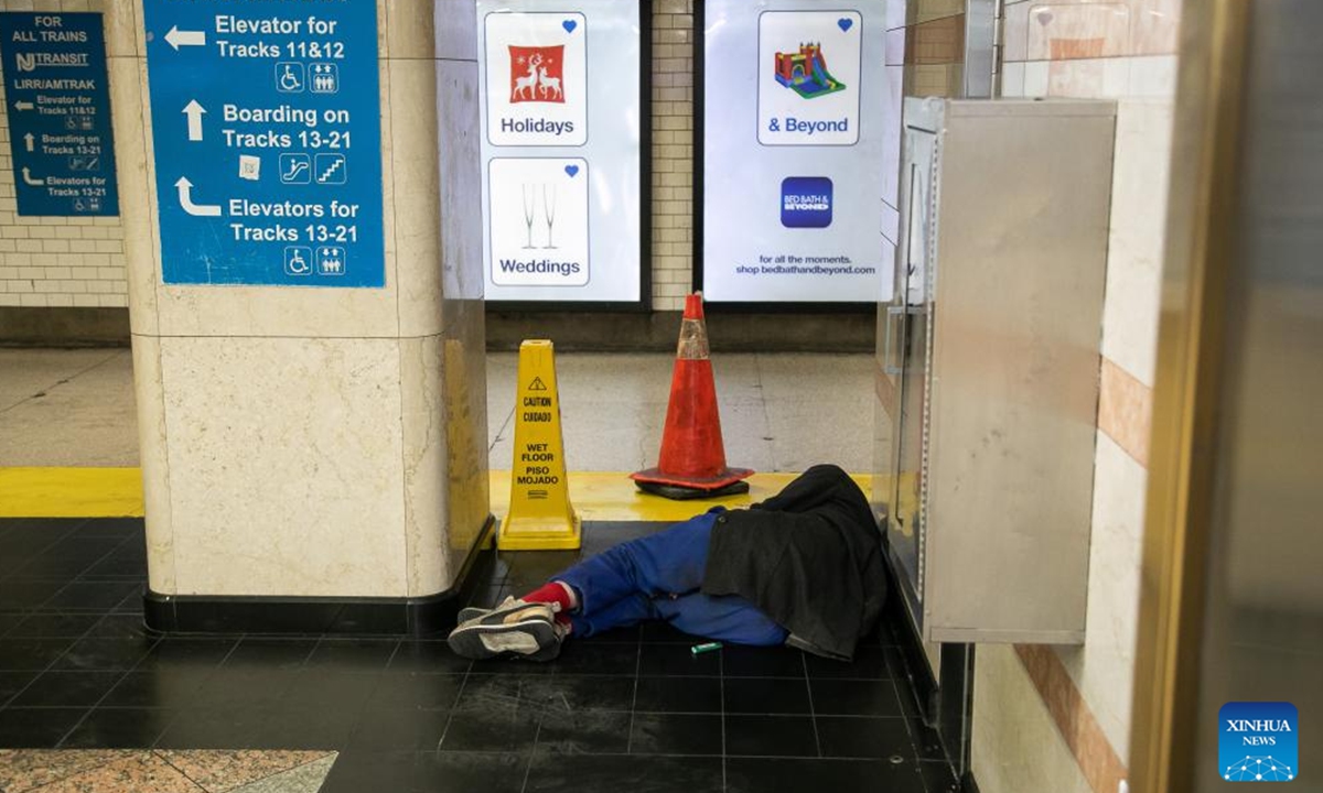 A homeless person is pictured at a subway station in New York, the United States, Dec. 23, 2023. The number of homeless people in the United States has increased by 12 percent to a record high, showed a government report on Dec. 15. (Photo by Michael Nagle/Xinhua)