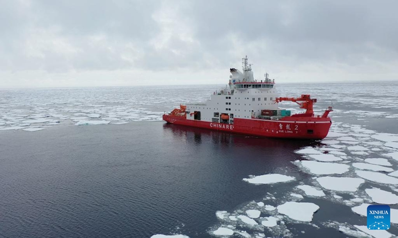 This aerial photo taken on Jan. 6, 2024 shows China's research icebreaker Xuelong 2 conducting scientific expedition in the Amundsen Sea. Members of China's 40th Antarctic expedition team have recently conducted scientific work aboard China's research icebreaker Xuelong 2 in the Amundsen Sea. (Photo by Chen Dongbin/Xinhua)