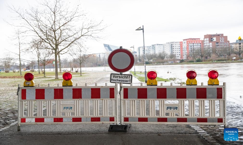 A warning sign of floods is seen in Frankfurt, Germany, Jan. 7, 2024. Some areas in Frankfurt were flooded due to continuous rainfall and rising water level of the Main River. (Xinhua/Zhang Fan)