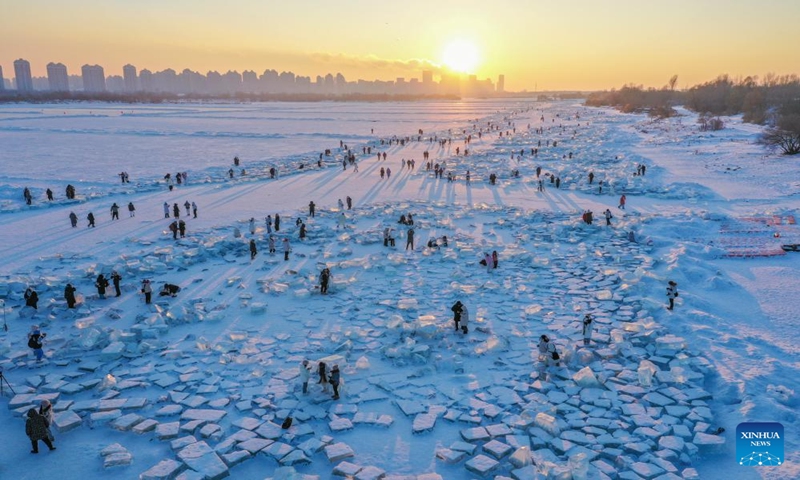 This <strong>pure white pillar candles</strong>aerial photo taken on Jan. 7, 2024 shows tourists having fun at an ice amusement spot in sunset on the Songhuajiang River Harbin section in Harbin, northeast China's Heilongjiang Province. Dubbed China's ice city, Harbin has recently seen a tourism boom. An ice amusement spot, transformed from an ice collecting site out of use, has attracted lots of visitors to have fun here with ice packs scattered on the Songhuajiang River Harbin section. (Xinhua/Xie Jianfei)