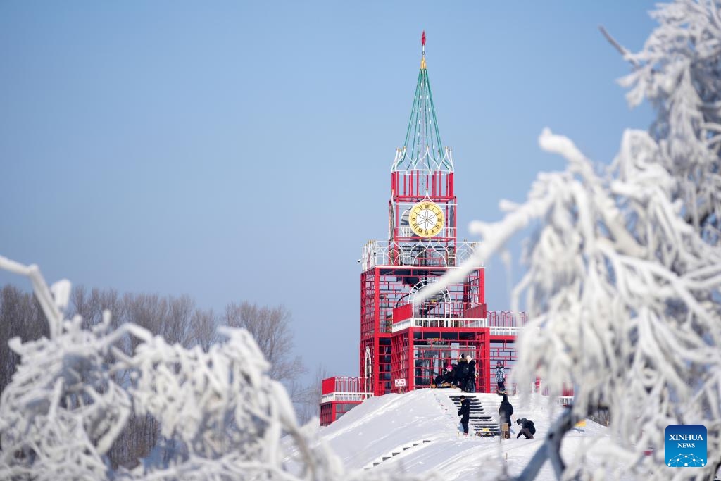 People enjoy themselves at the Volga Manor in Harbin, northeast China's Heilongjiang Province, Jan. 7, 2024. The Volga Manor, a Russian culture-themed park, turned into a world of ice and snow during the winter time, attracting lots of visitors.(Photo: Xinhua)