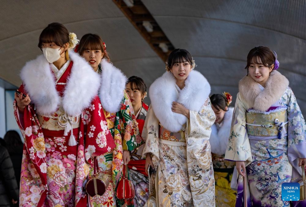 Girls walk to attend a Coming of Age Day ceremony in Yokohama, Japan, Jan. 8, 2024. Coming of Age Day is a public holiday in Japan held annually on the second Monday of January. With the enactment of the revised Civil Code in April 2022, the age of adulthood was lowered to 18 from 20.(Photo: Xinhua)