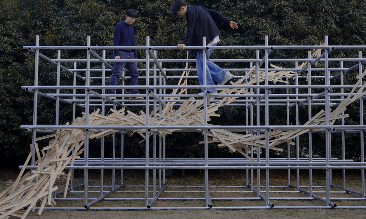 Students create an interactive art installation with bamboo strips and steel pipes for Gejia village. Photo: Courtesy of Ding Hancong