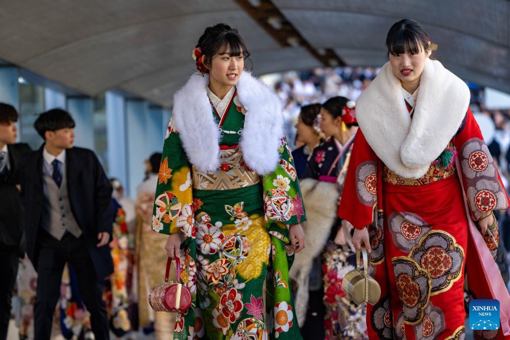 Youths walk to attend a Coming of Age Day ceremony in Yokohama, Japan, Jan. 8, 2024. Coming of Age Day is a public holiday in Japan held annually on the second Monday of January. With the enactment of the revised Civil Code in April 2022, the age of adulthood was lowered to 18 from 20.(Photo: Xinhua)