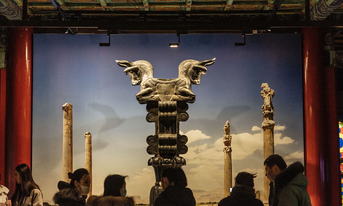 Visitors look at the ancient Persian relics displayed at the Palace Museum in Beijing on January 11, 2024. A themed exhibition entitled