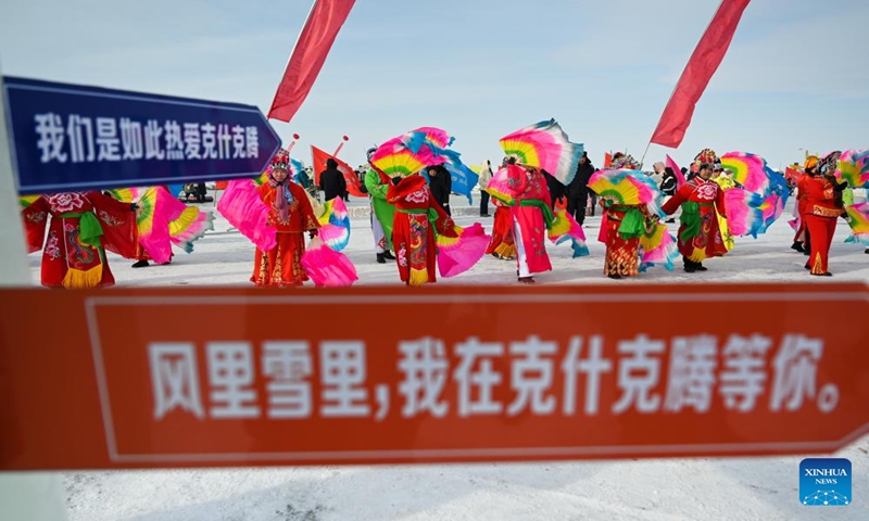 People perform on the Dalinor Lake in Chifeng City, north China's Inner Mongolia Autonomous Region, Jan. 13, 2024. A promotion event for tourism and winter fishing kicked off at the Dalinor Lake of Hexigten Banner in Chifeng. Featuring fishing, performance and other activities, this event attracted many tourists. (Xinhua/Liu Lei)