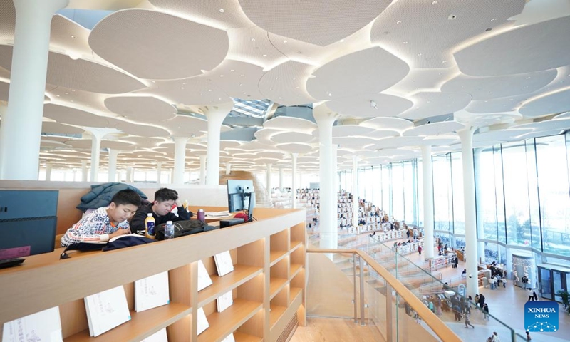 This photo taken on Jan. 14, 2024 shows an interior view of Beijing Library in Beijing, capital of China. Many citizens visited the recently opened library to spend their leisure time this weekend. (Xinhua/Peng Ziyang)