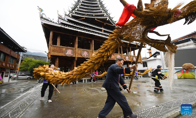 Residents practice the dragon dance in Guangnan village of Pingdeng township in Longsheng County, south China's Guangxi Zhuang Autonomous Region, Jan. 13, 2024. China's 2024 Spring Festival holiday will run from Feb. 10 to 17. (Photo by Pan Zhixiang/Xinhua)