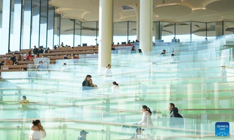 This photo taken on Jan. 14, 2024 shows an interior view of Beijing Library in Beijing, capital of China.Many citizens visited the recently opened library to spend their leisure time this weekend. (Xinhua/Peng Ziyang)