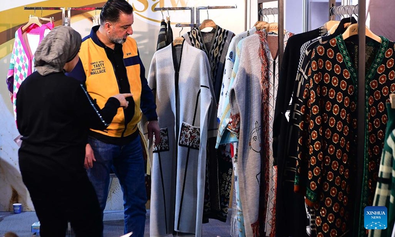 People attend the Syrian fashion expo in Damascus, Syria, on Jan. 11, 2024. The Syrian fashion expo, Motex Khan Al-Hareer, a textile, clothing and production tools fair, kicked off here on Thursday. (Photo: Xinhua)