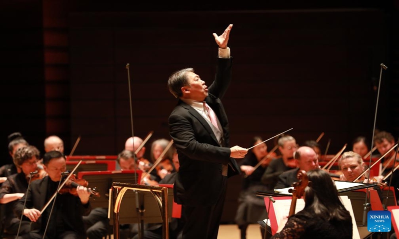 Yu Long (C), who holds senior positions at the China Philharmonic Orchestra in Beijing, the Shanghai Symphony Orchestra and the Hong Kong Philharmonic Orchestra, conducts during a concert presented by the Philadelphia Orchestra to celebrate Chinese New Year in Verizon Hall at the Kimmel Center for the Performing Arts in Philadelphia, the United States, Jan. 12, 2024.