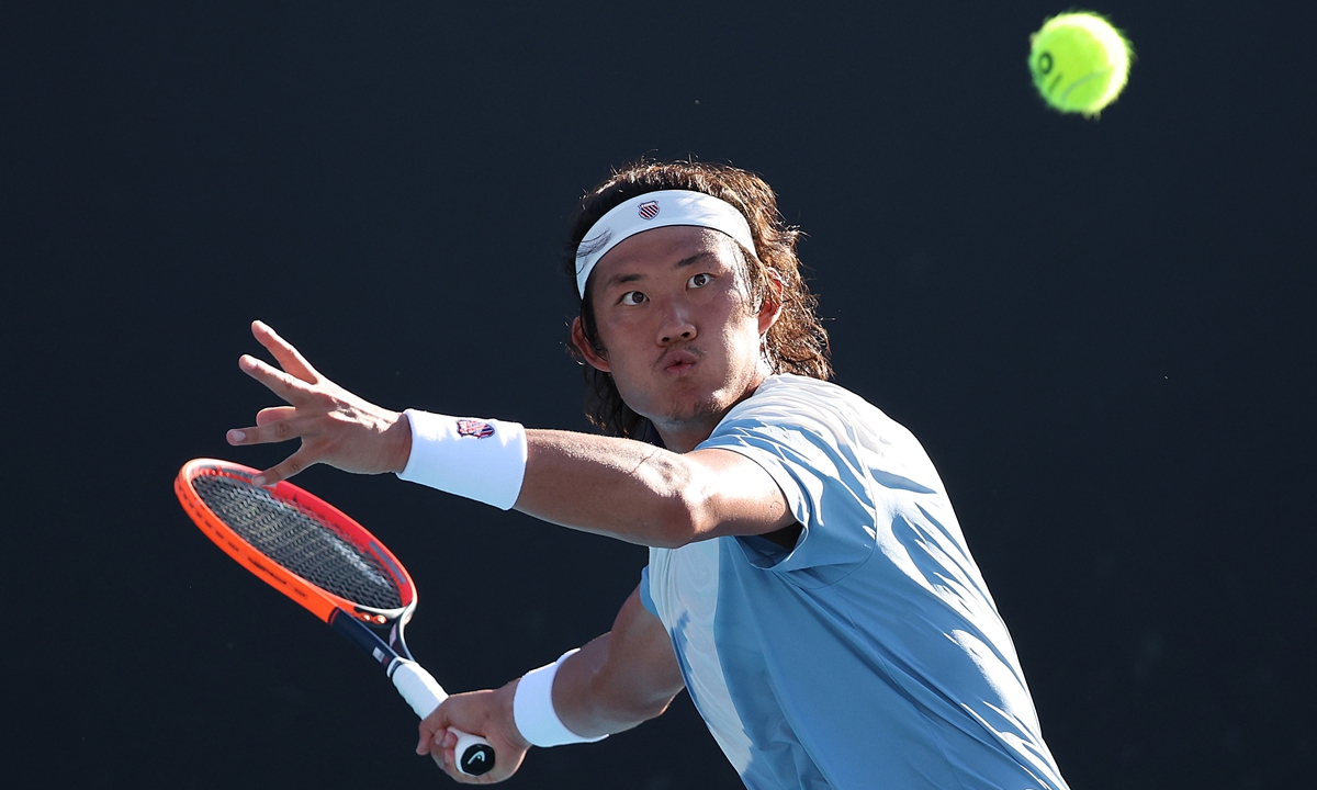 Chinese tennis player Zhang Zhizhen aims for a shot against Argentina's Federico Coria during their first-round clash at the 2024 Australian Open in Melbourne, Australia on January 15, 2024. After a 6-4, 7-6 (7/3), 7-6 (7/5), Zhang became the second male player from the Chinese mainland to make the second round at the Australian Open in the Open era after Shang Juncheng did so in 2023. Photo: VCG