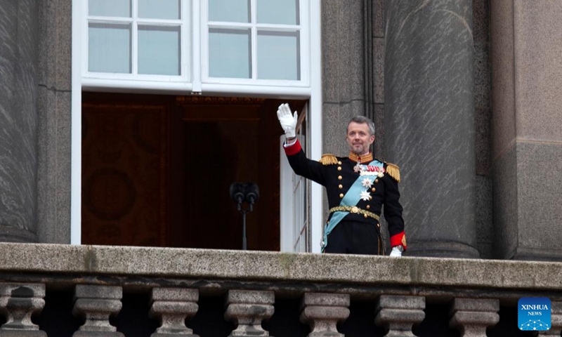 Denmark's newly proclaimed King Frederik X waves on the balcony of Christiansborg Palace in Copenhagen, Denmark, Jan. 14, 2024. Denmark's Crown Prince Frederik was formally proclaimed king by the country's prime minister Mette Frederiksen on Sunday. (Xinhua/Lin Jing)