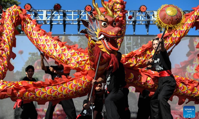 Performers play a dragon dance during an event to greet the upcoming Spring Festival in Santiago, Chile, Jan. 13, 2024. (Photo by Jorge Villegas/Xinhua)