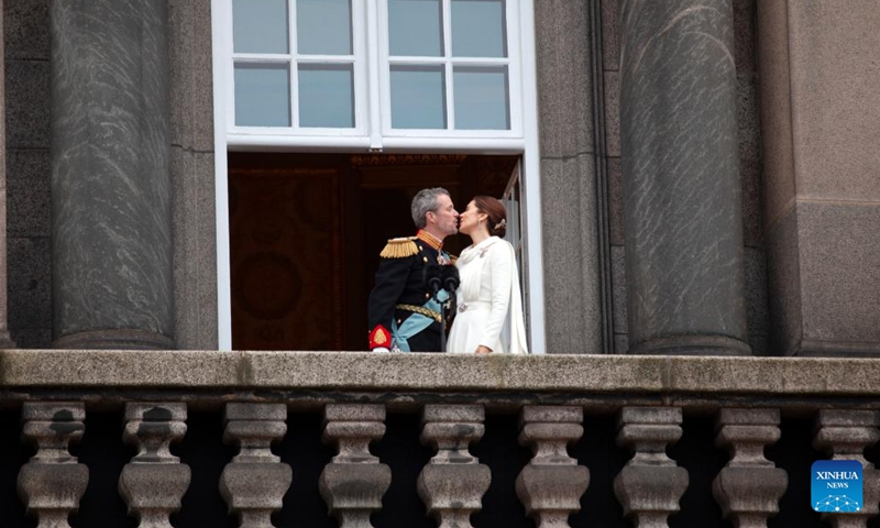 Denmark's newly proclaimed King Frederik X(L) kisses Queen Mary on the balcony of Christiansborg Palace in Copenhagen, Denmark, Jan. 14, 2024. Denmark's Crown Prince Frederik was formally proclaimed king by the country's prime minister Mette Frederiksen on Sunday. (Xinhua/Lin Jing)