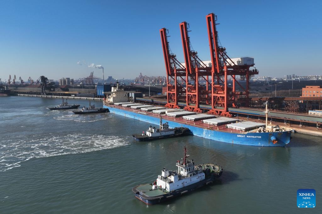 An aerial photo taken on Jan. 15, 2024 shows a ship docking at a coal terminal of Tangshan Port in north China's Hebei Province. In 2023, the cargo throughput at Tangshan Port surpassed 842.17 million tonnes, up 9.53 percent year on year, according to port authorities.(Photo: Xinhua)