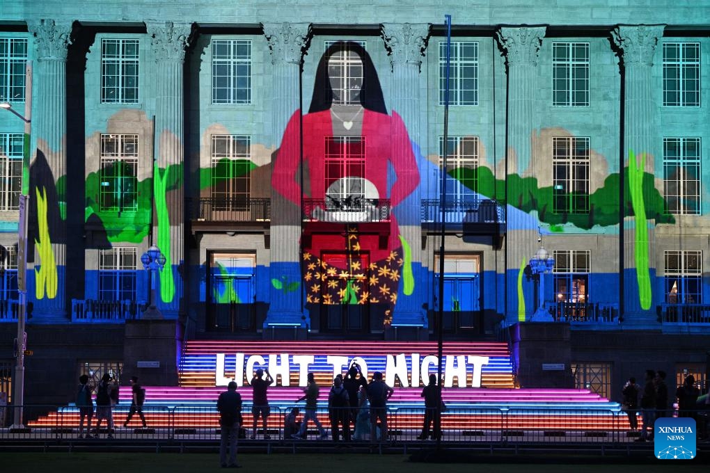 People view light projections and installations during a media preview of the Light to Night Festival at Singapore's Civic District on Jan. 16, 2024. The Light to Night Festival will be held from Jan. 19 to Feb. 8 in various locations in the Civic District.(Photo: Xinhua)