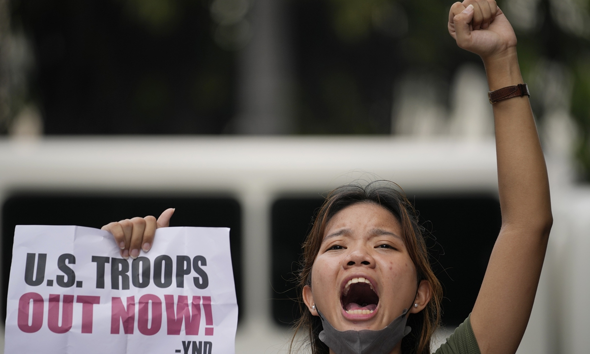 A demonstrator protests against the continued presence of US troops in the Philippines during a rally near the US Embassy in Manila, on July 4, 2023, which marked Philppine-American Friendship Day. Photo: VCG