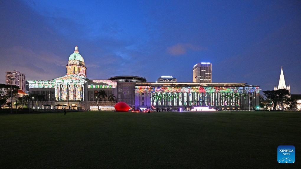 People view light projections and installations during a media preview of the Light to Night Festival at Singapore's Civic District on Jan. 16, 2024. The Light to Night Festival will be held from Jan. 19 to Feb. 8 in various locations in the Civic District.(Photo: Xinhua)